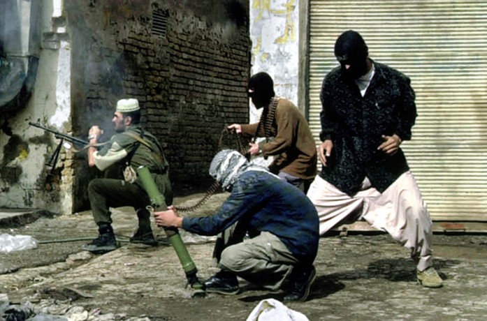 Fallujah - Iraqi insurgents fire a mortar and small arms during the U.S.-led offensive against insurgents in the city. 