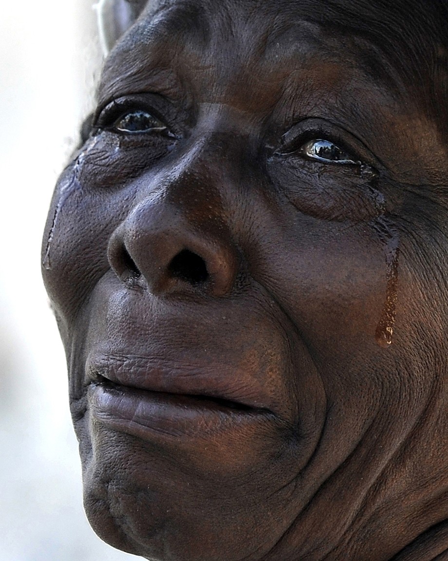 'Haiti Weeps' The earthquake’s emotional toll is etched on the faces of Haitians attending a worship service at Cathedral Notre Dame, which was destroyed in the quake. The streets were filled with beleaguered residents milling about, left with no jobs, no instructions on what to do, and no place to buy food or to take the injured. Many said they felt totally alone and saw no evidence that relief was on the way, and their mournful pleas began to give way to anger. (Carol Guzy, The Washington Post - January 2