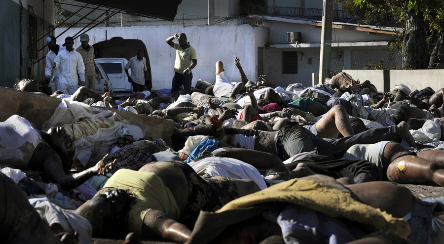 'Sea of Sadness' Bodies were piled on street corners and at the city morgue, and residents stepped past quickly, holding limes to their noses to block the stench. Family members were moving their dead across the city in coffins borne on shoulders. One man ferried a body down a street in a wheelbarrow. A crew of men with shirts wrapped around their faces lurched down the block in a converted school bus stacked with corpses. (Carol Guzy, The Washington Post - January 15, 2010)