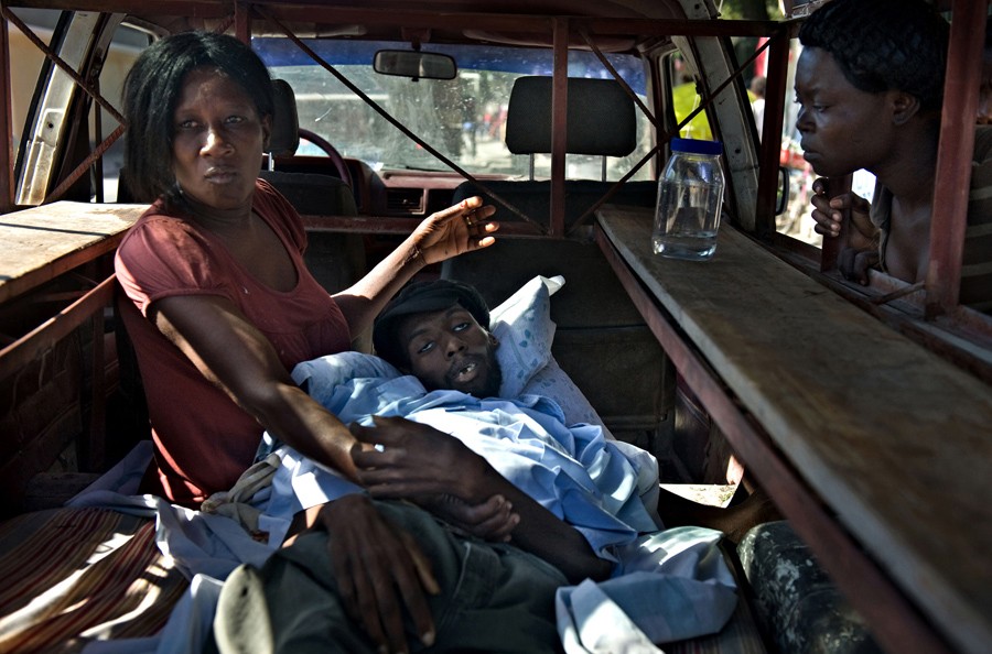 'Cholera' Sylvia Frederic tries in vain to rush her son Johnny Frederic, 26, to the hospital before he dies in her arms. Still reeling from the earthquake, Haiti's misery was deepened by a cholera epidemic that claimed many lives. Cholera can cause vomiting and diarrhea so severe that it can kill from dehydration in hours. The disease had not been seen in Haiti for decades, and many people didn't know about it. (Nikki Kahn, The Washington Post - November 25, 2010)